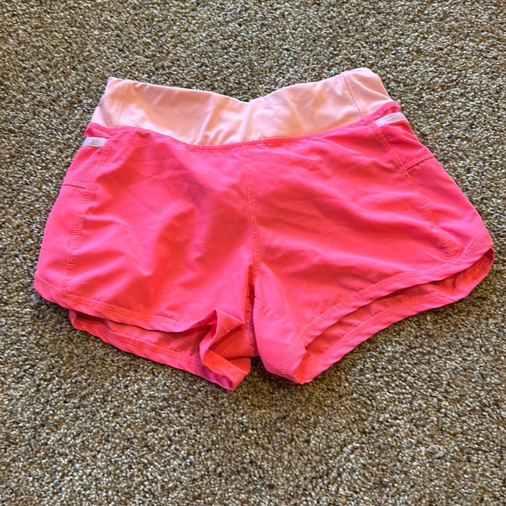 Girls Neon pink athletic shorts.